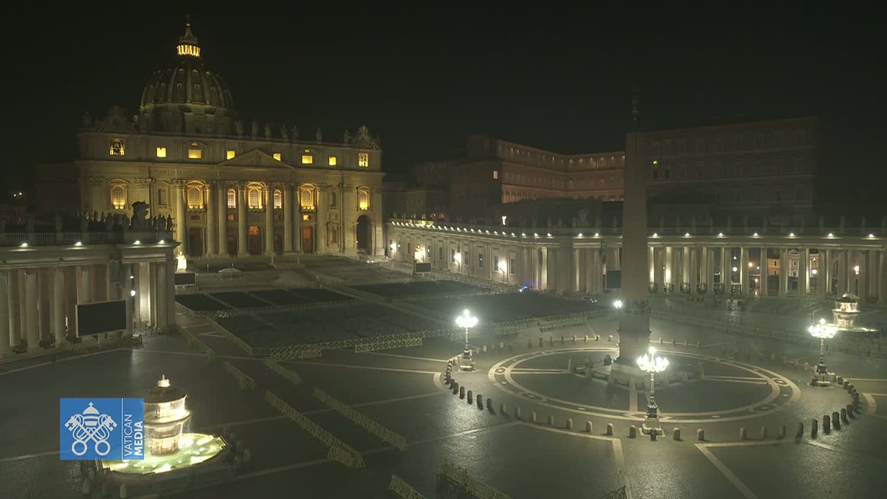 St. Peter's Basilica and St. Peter's Square are illuminated at night, appearing mostly empty under a dark sky.
