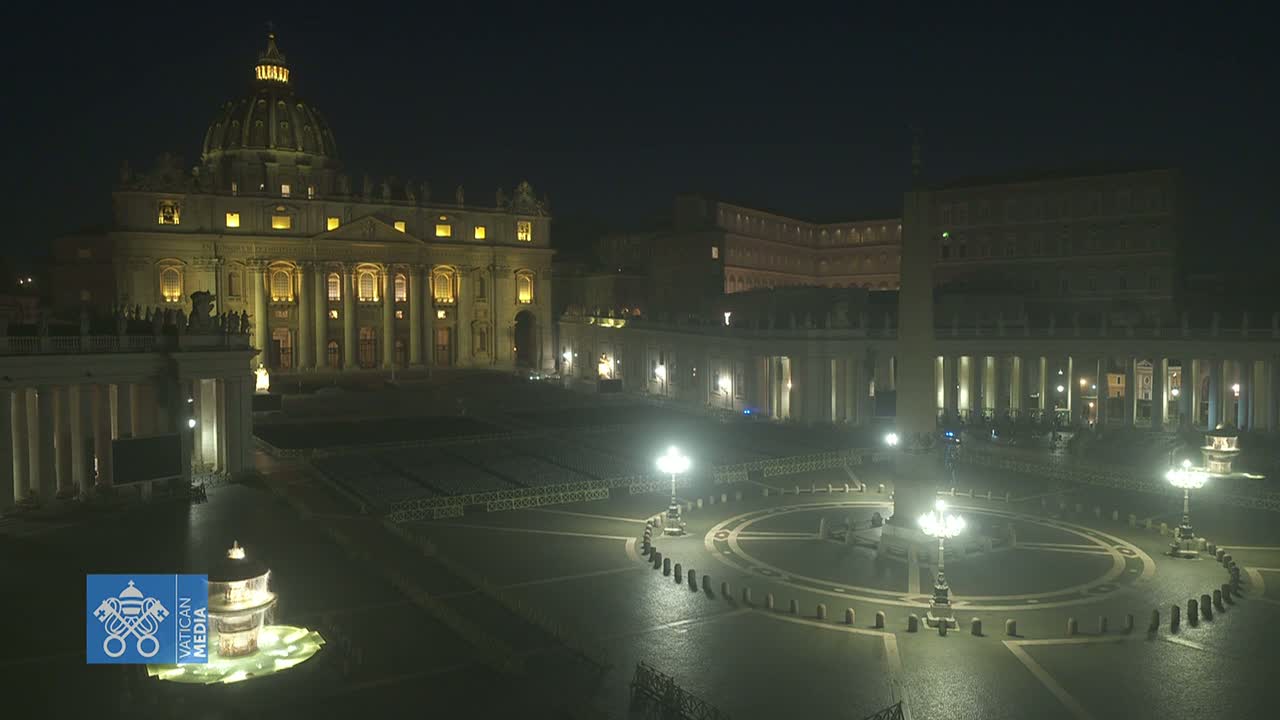 St. Peter's Basilica and St. Peter's Square are illuminated at night, appearing mostly empty under a dark sky.