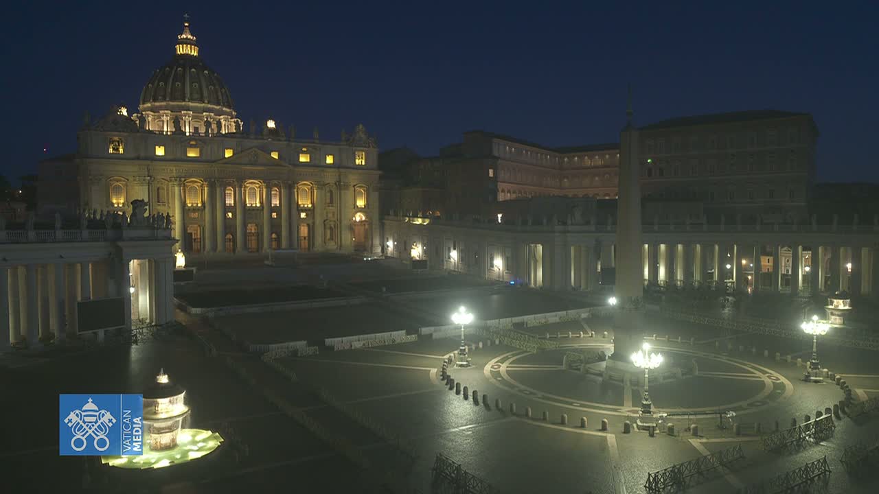 St. Peter's Basilica and St. Peter's Square are illuminated at night, appearing empty under a dark sky.