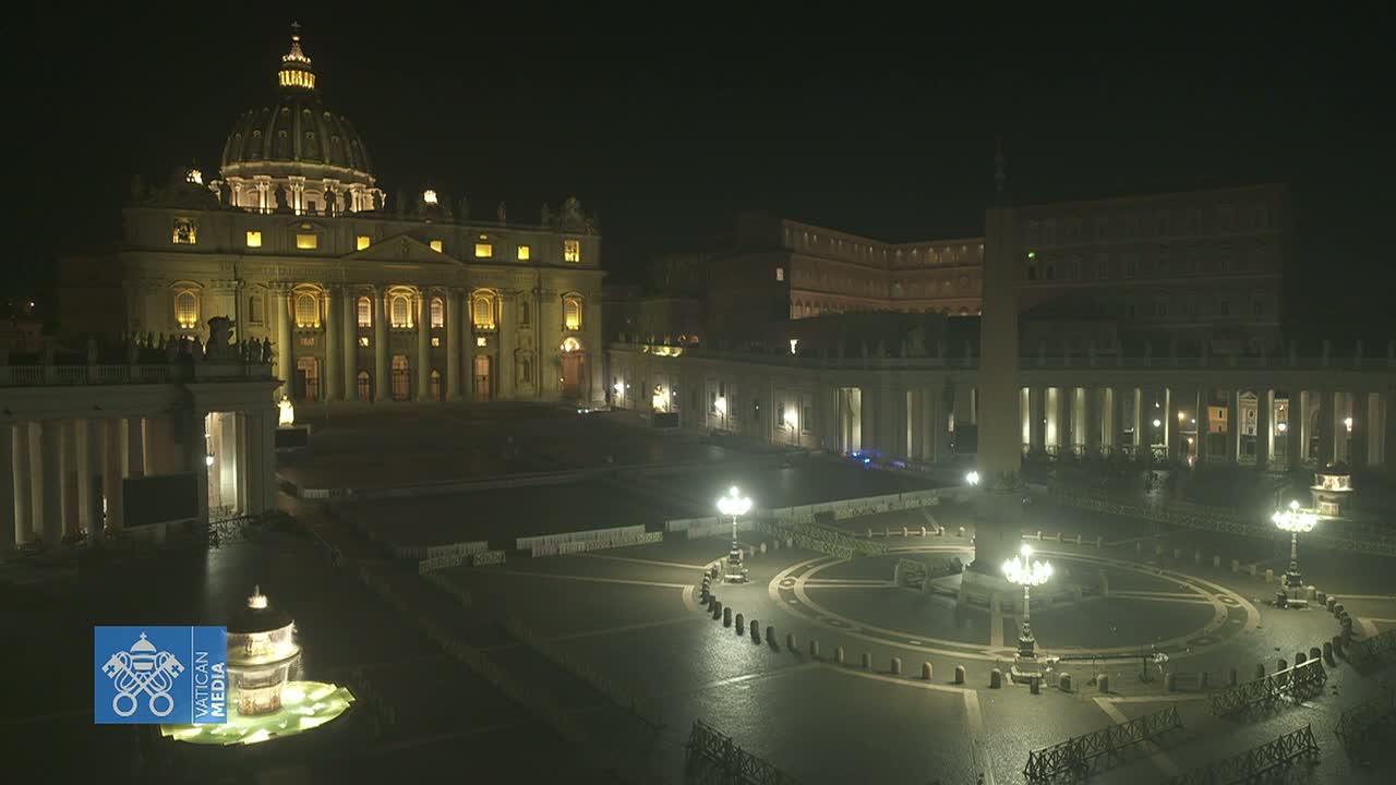 St. Peter's Basilica and St. Peter's Square are illuminated at night, appearing mostly empty under dark, clear skies.