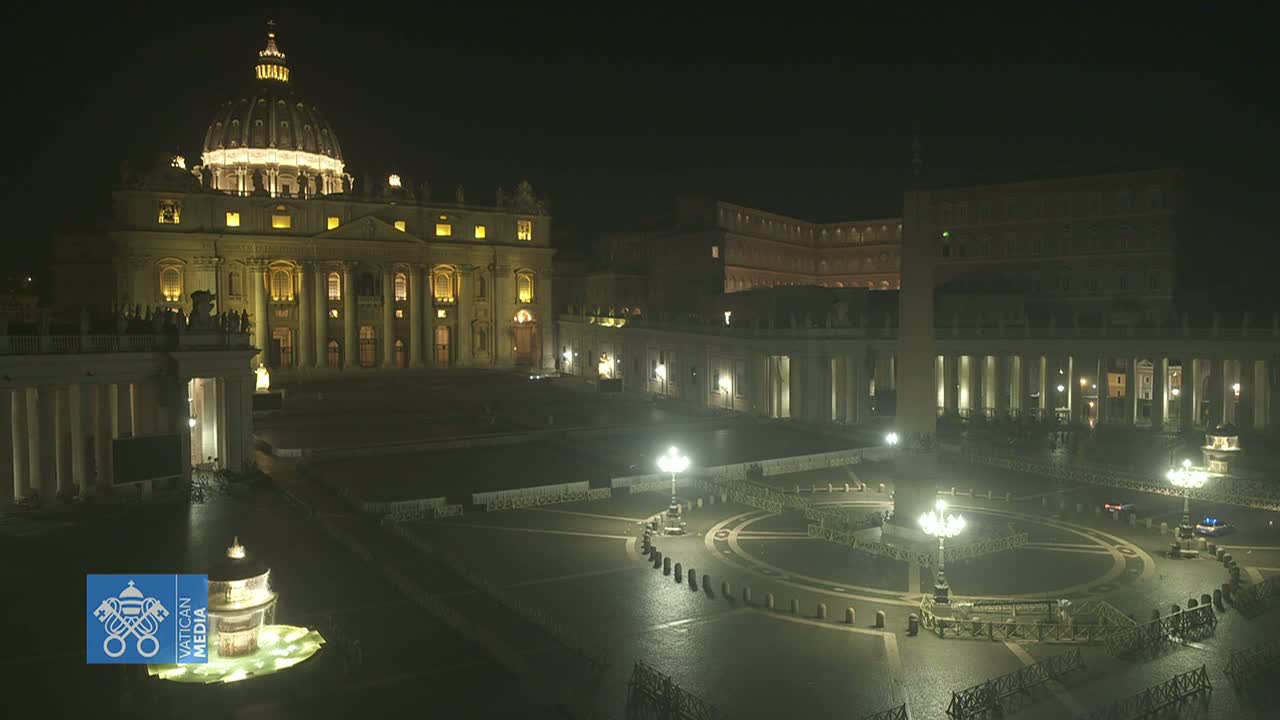 St. Peter's Basilica and St. Peter's Square are illuminated at night, appearing mostly empty under a dark sky.
