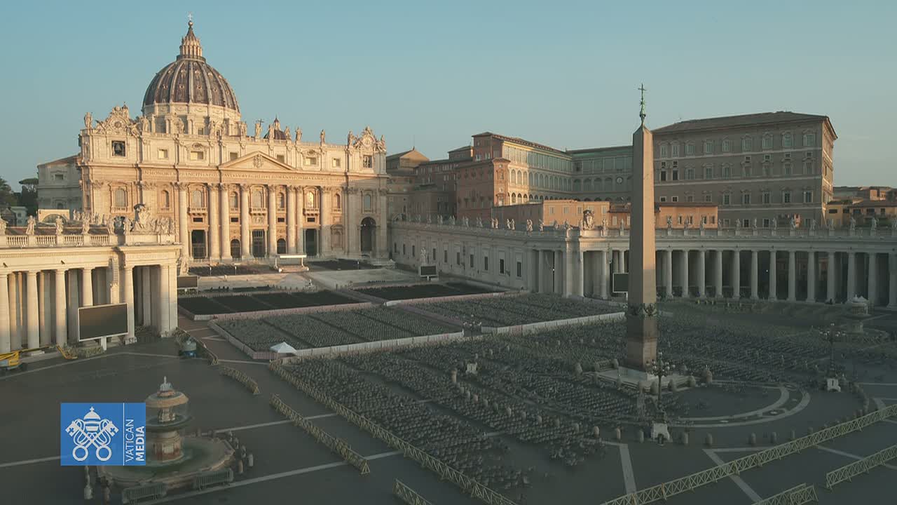 St. Peter's Basilica and Square in Vatican City, filled with rows of empty chairs under a clear, bright sky.
