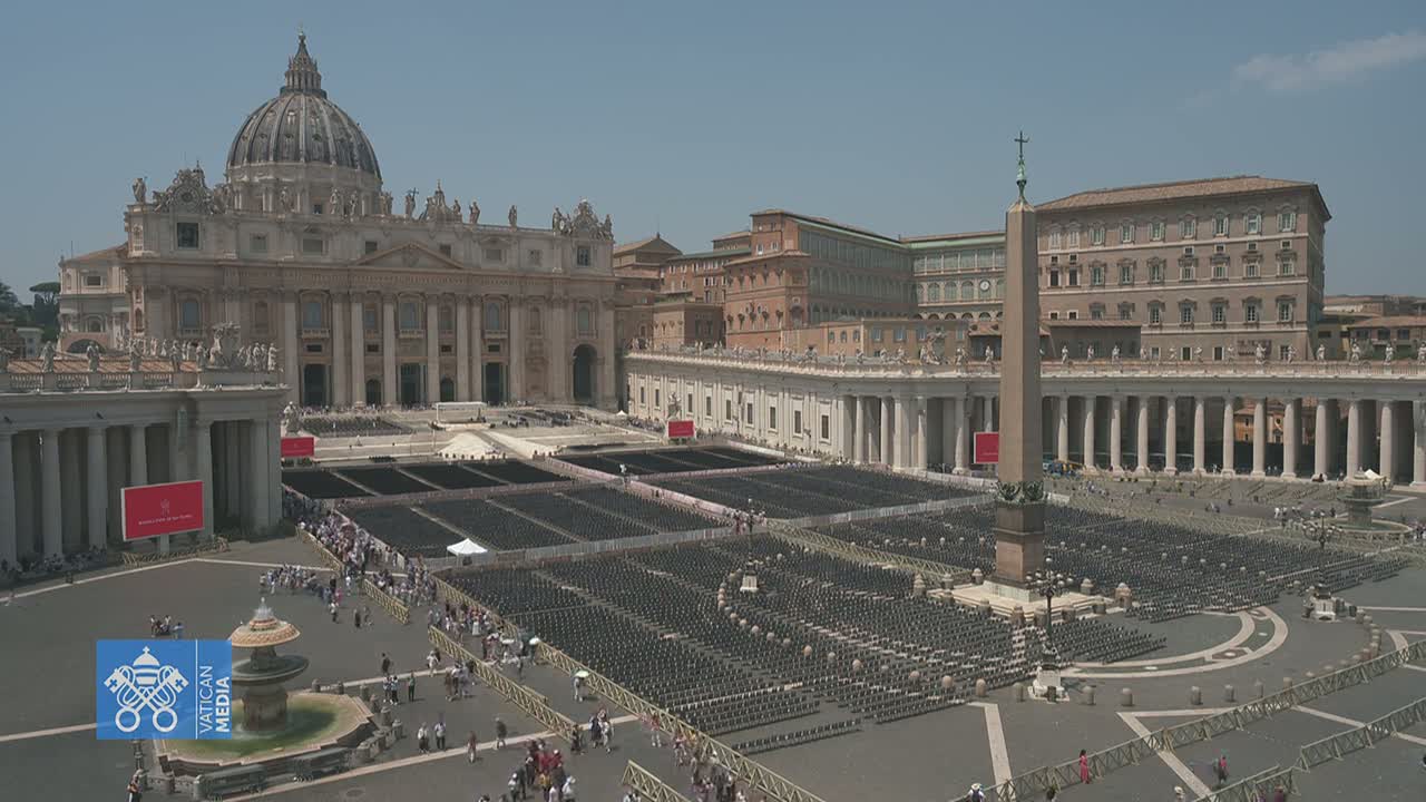 St. Peter's Square in Vatican City, under a clear sunny sky, is filled with rows of empty chairs in preparation for a large gathering.