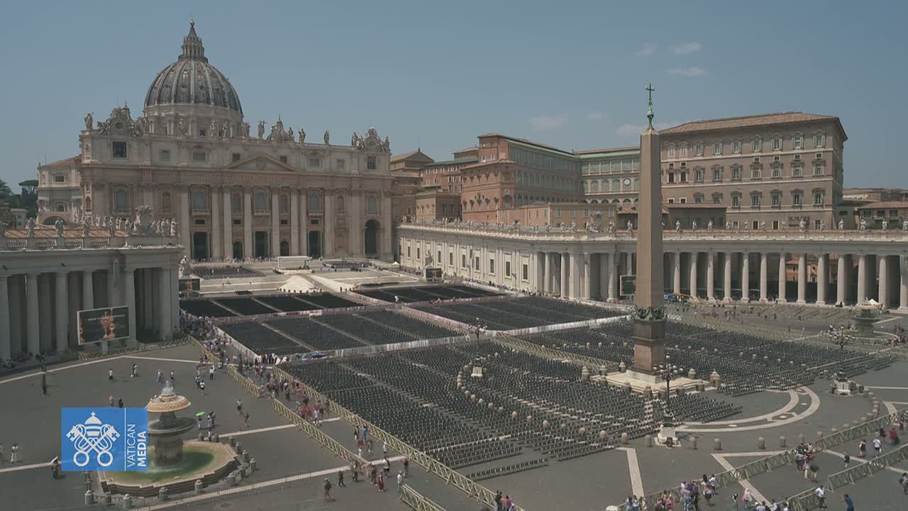 St. Peter's Basilica and Square are shown on a sunny day, with many chairs set up in the square.
