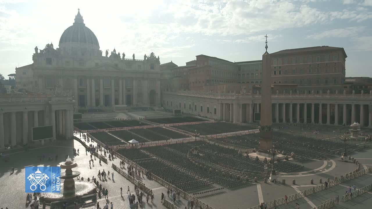 St. Peter's Basilica and Square in Vatican City are shown on a partly cloudy day, with numerous chairs set up in the square.