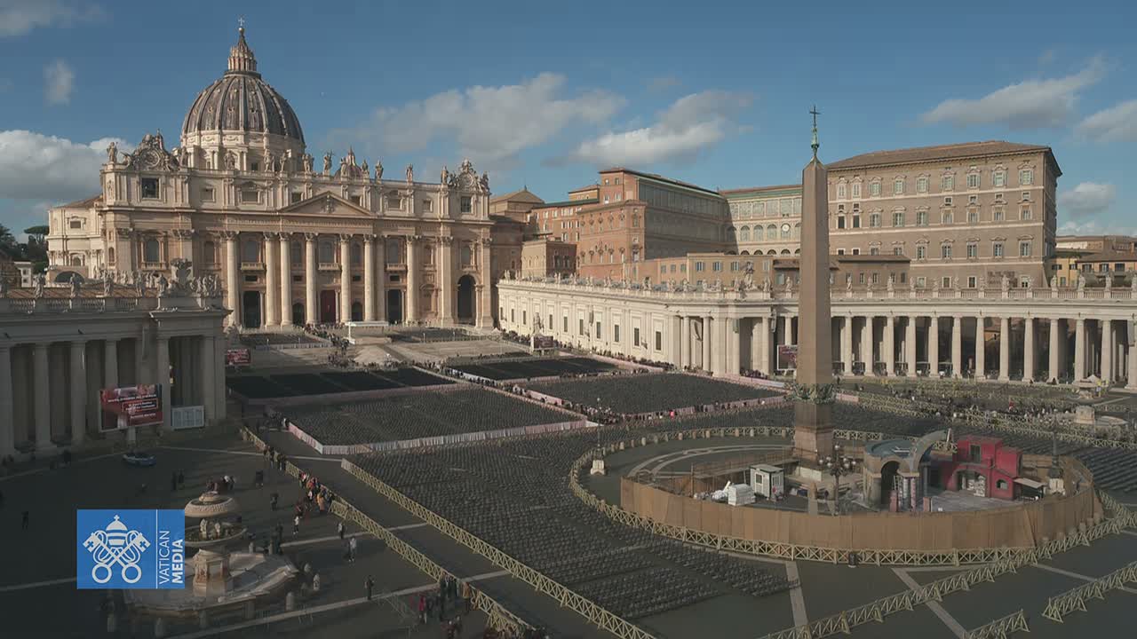 St. Peter's Square is depicted on a clear, sunny day with scattered clouds, showcasing St. Peter's Basilica and the Vatican Palace overlooking a vast expanse of thousands of empty chairs set up for a large event.