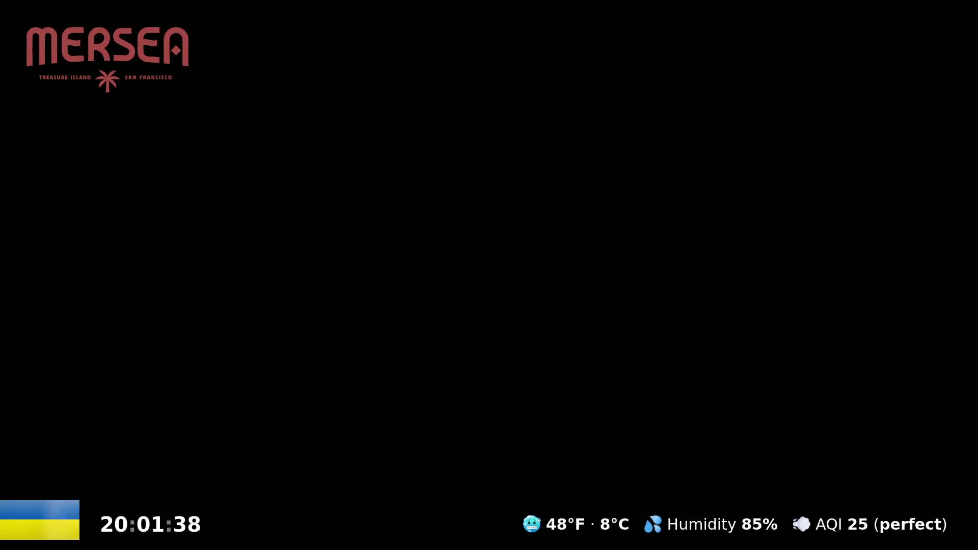 A black screen displays a time, the Ukrainian flag, and weather information indicating 48°F (8°C) and 85% humidity with a perfect air quality index of 25.