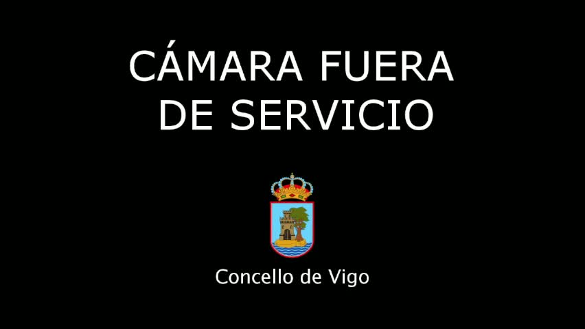 A black background displays white text stating "Camera Out of Service" in Spanish, along with a coat of arms.