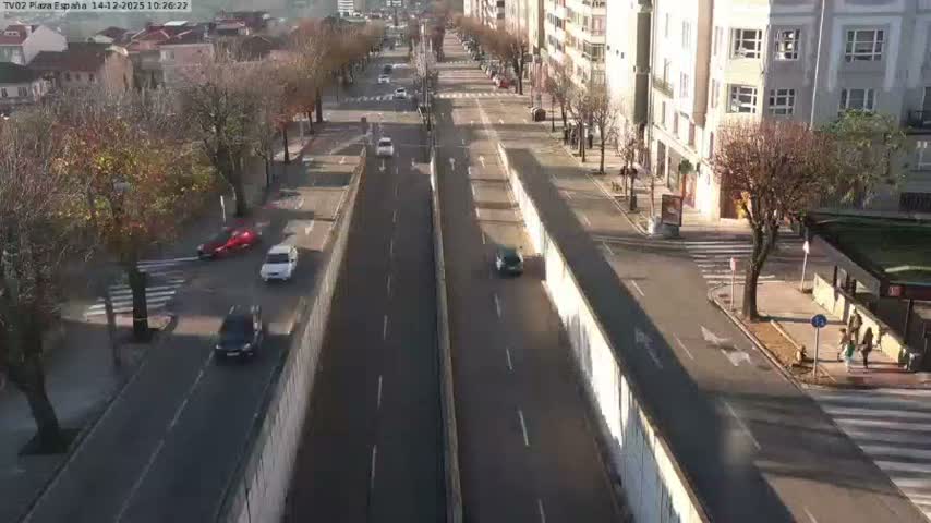 A busy urban intersection is depicted at night with vehicles on the roads, pedestrians crossing and waiting, and streetlights illuminating the scene under clear weather.
