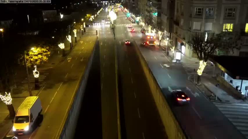 A busy urban intersection is depicted at night with vehicles on the roads, pedestrians crossing and waiting, and streetlights illuminating the scene under clear weather.