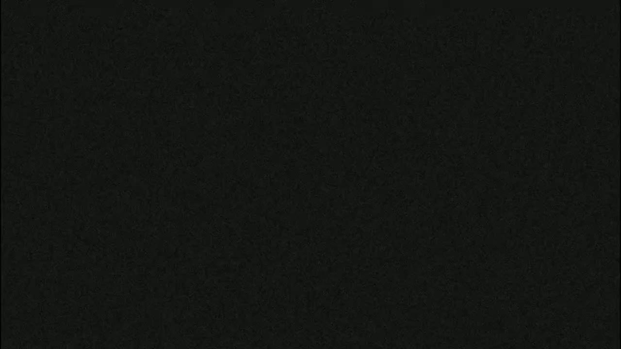 The image shows a uniformly dark gray or black textured surface.