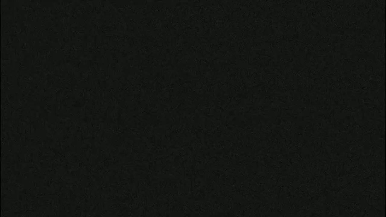 The image shows a dark-colored, textured surface.