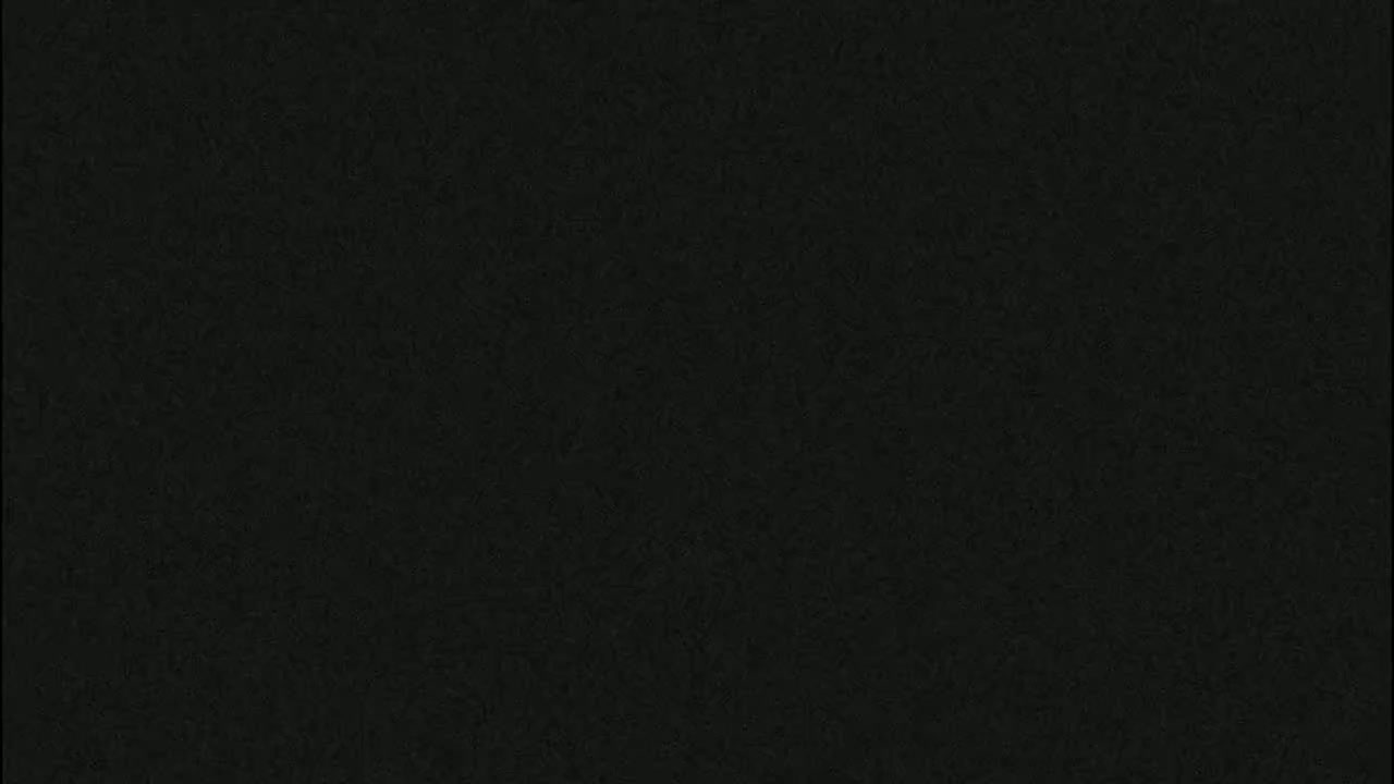 The image shows a uniformly dark gray or black textured surface.