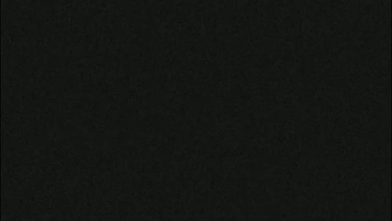 The image is a solid dark-grey/black color with a slightly textured appearance.