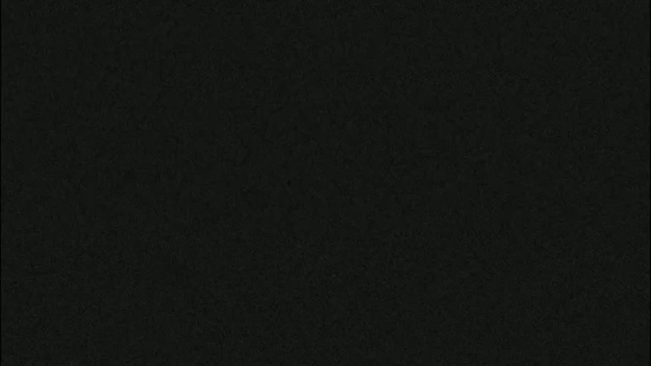 The image shows a uniformly dark gray or black textured surface.