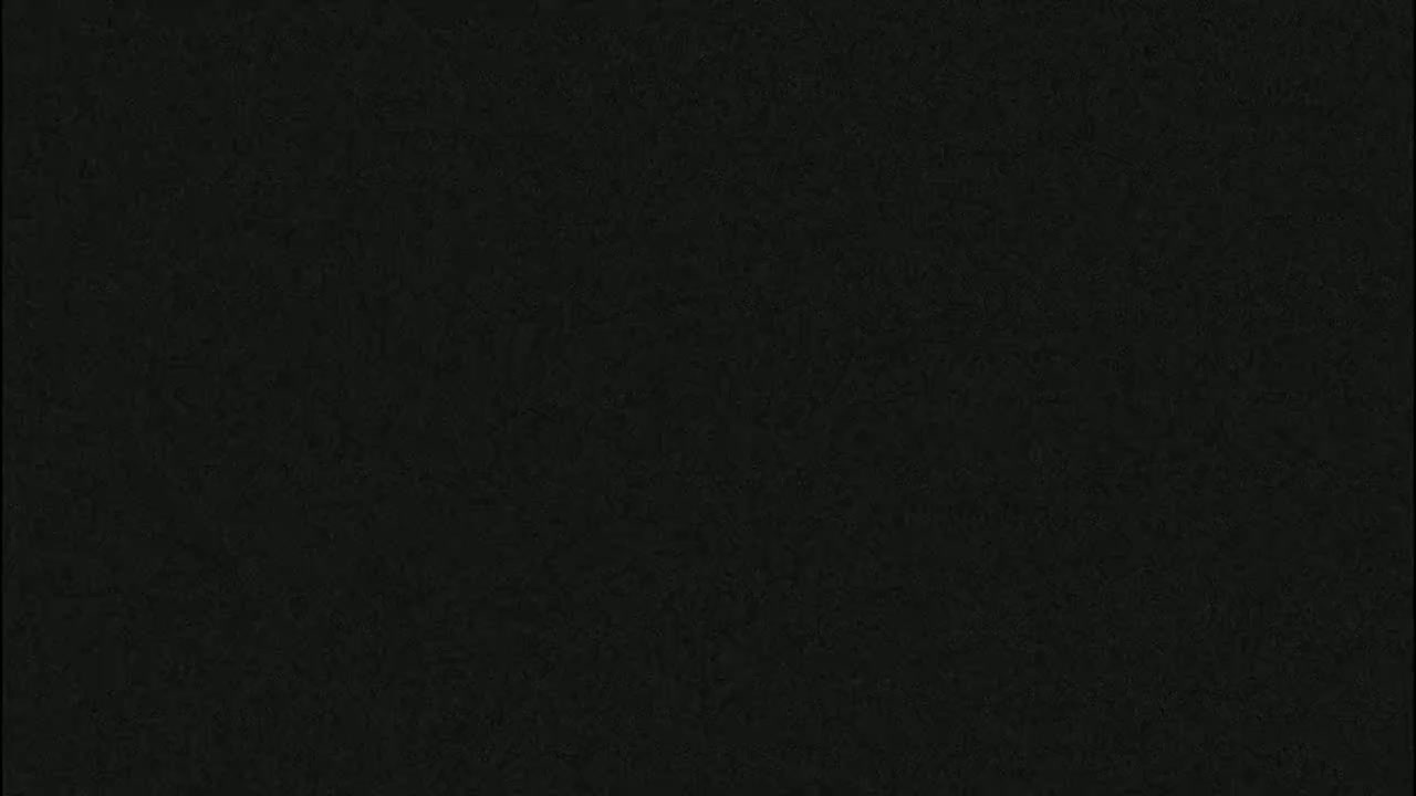 The image is a solid dark-grey or black textured background.