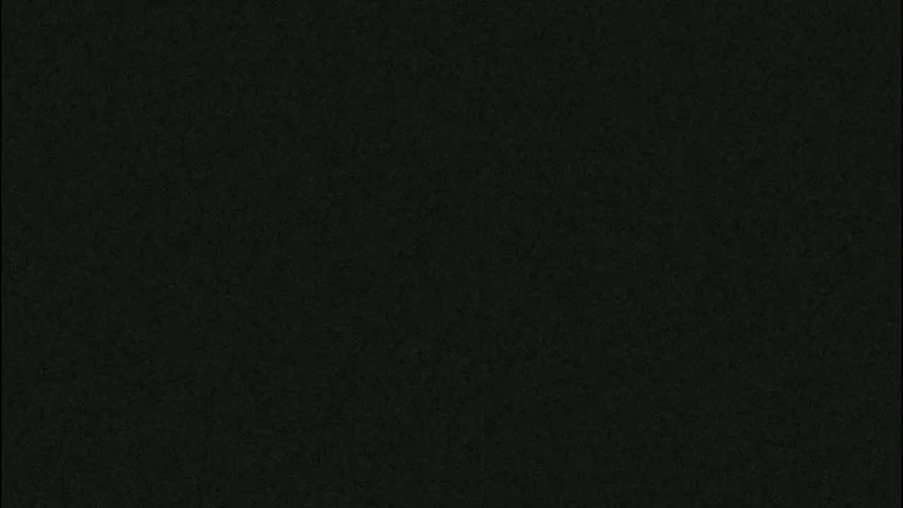 The image shows a dark, textured surface.