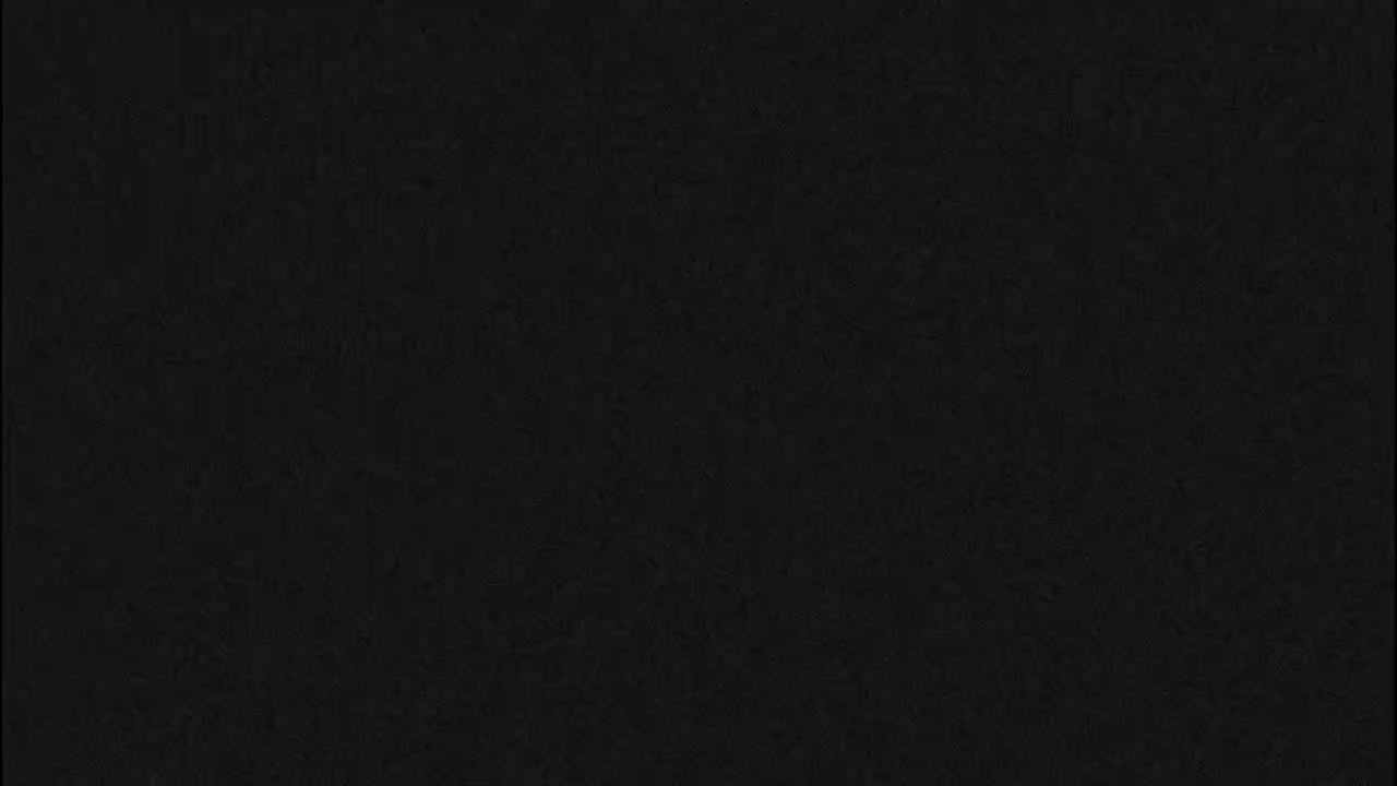 The image is a solid dark-grey or black textured background.