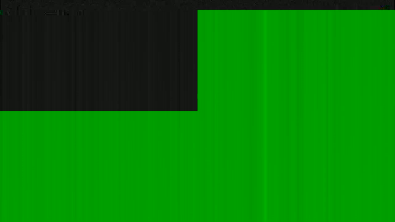 The image shows a mostly green surface with a smaller black area in the upper left corner.