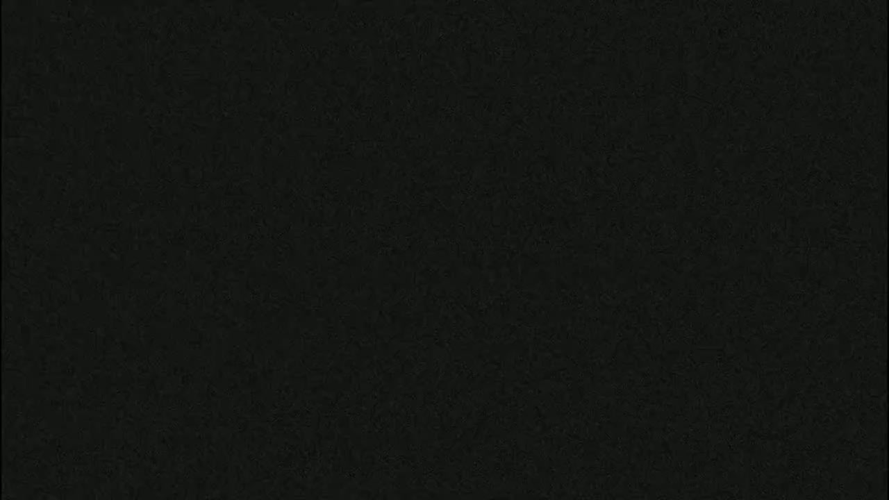 The image shows a dark, textured surface.