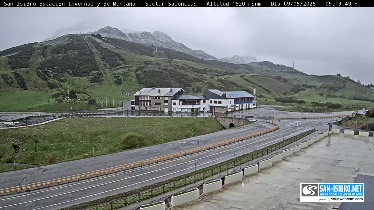 A mountain resort area with buildings and roads is shown on an overcast day.