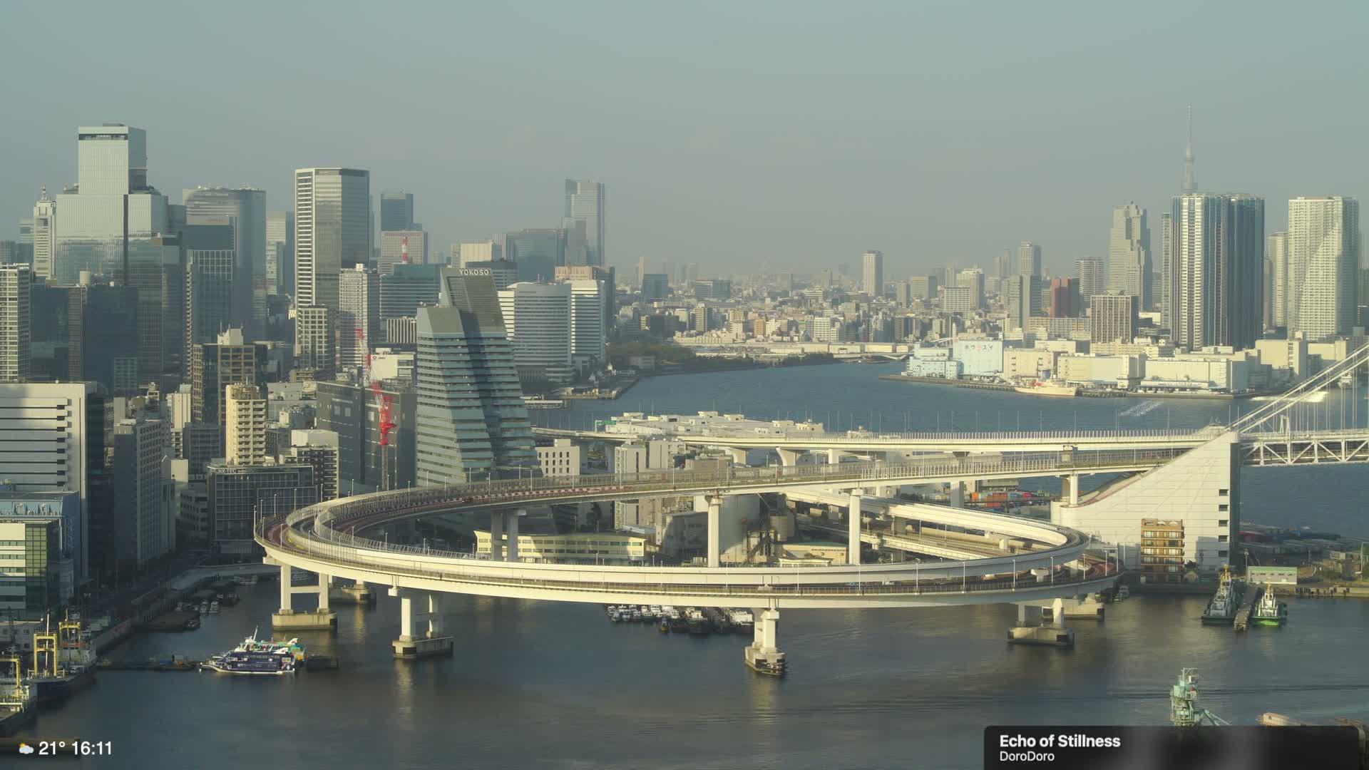 Tokyo City Center Skyline, Tokyo Bay & Rainbow Bridge Kaigan Entrance (東京の街並み、東京湾、レインボーブリッジ)  Live Cam - 5 Chome, Konan, Minato-ku, Tokyo, Kantō, Honshu, Japan