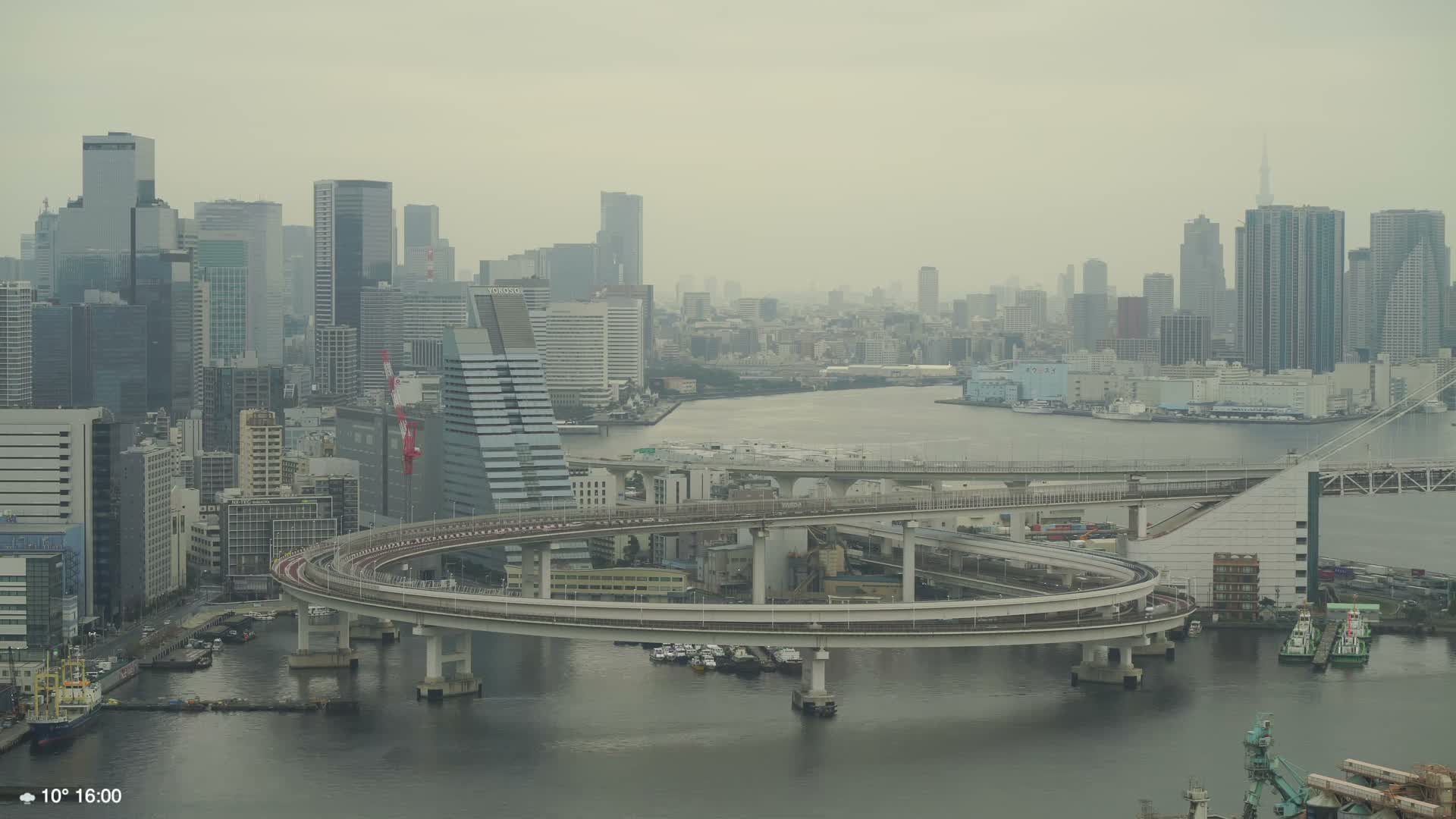 Tokyo City Center Skyline, Tokyo Bay & Rainbow Bridge Kaigan Entrance (東京の街並み、東京湾、レインボーブリッジ)  Live Cam - 5 Chome, Konan, Minato-ku, Tokyo, Kantō, Honshu, Japan