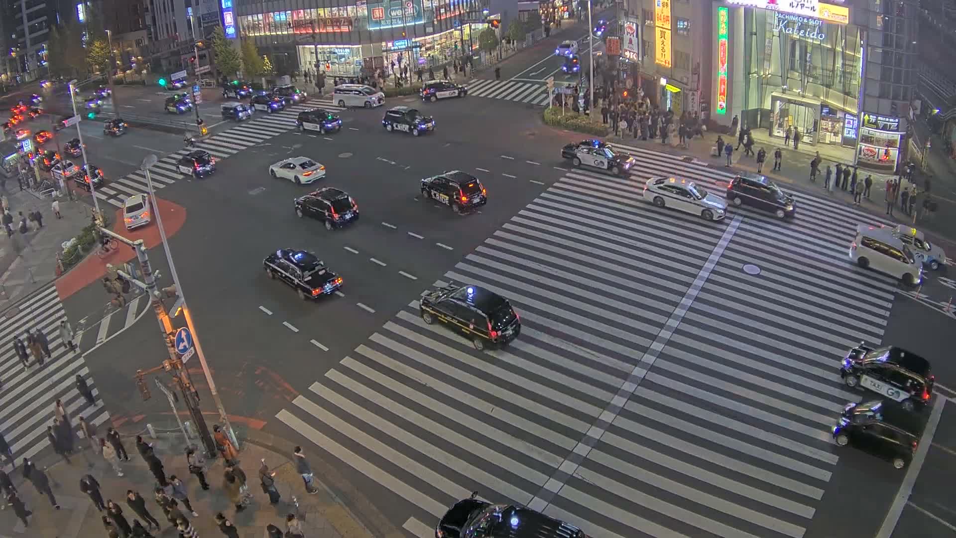 Tokyo, Shinjuku, Ome-kaido Avenue & Otakibashi-dori O Guard Intersection Scramble Crossing ( 東京 新宿青梅街道・小滝橋通り大ガード交差点スクランブル交差点) Live Cam  - Nishishinjuku, Shinjuku-ku, Tokyo, Kantō, Honshu, Japan