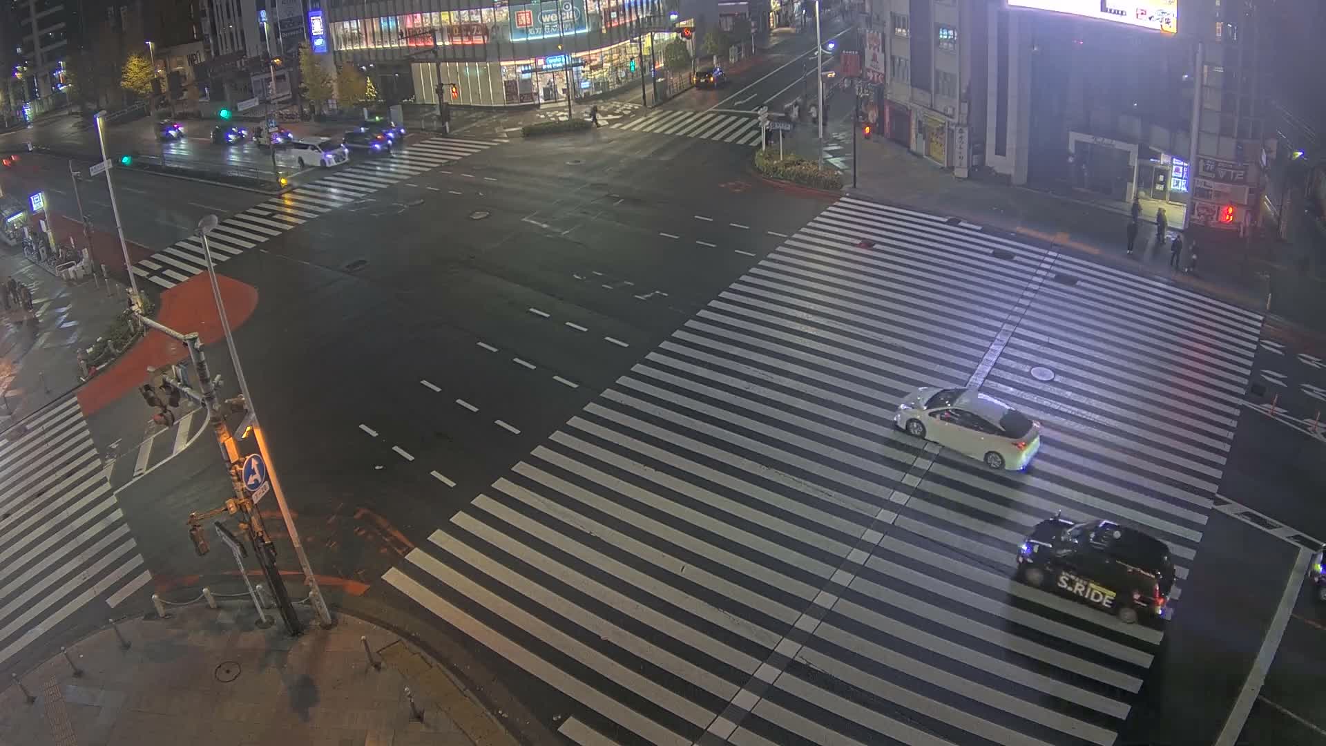 Tokyo, Shinjuku, Ome-kaido Avenue & Otakibashi-dori O Guard Intersection Scramble Crossing ( 東京 新宿青梅街道・小滝橋通り大ガード交差点スクランブル交差点) Live Cam  - Nishishinjuku, Shinjuku-ku, Tokyo, Kantō, Honshu, Japan
