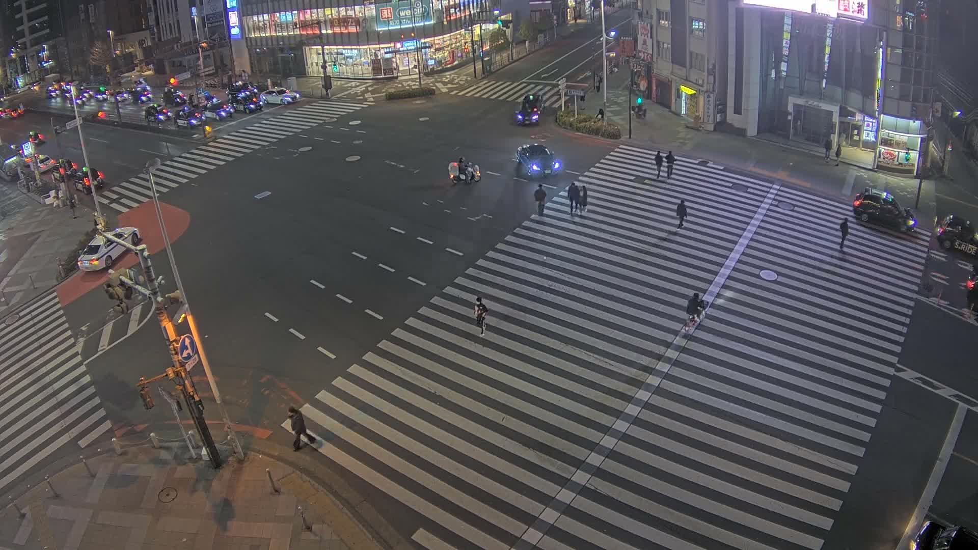 Tokyo, Shinjuku, Ome-kaido Avenue & Otakibashi-dori O Guard Intersection Scramble Crossing ( 東京 新宿青梅街道・小滝橋通り大ガード交差点スクランブル交差点) Live Cam  - Nishishinjuku, Shinjuku-ku, Tokyo, Kantō, Honshu, Japan