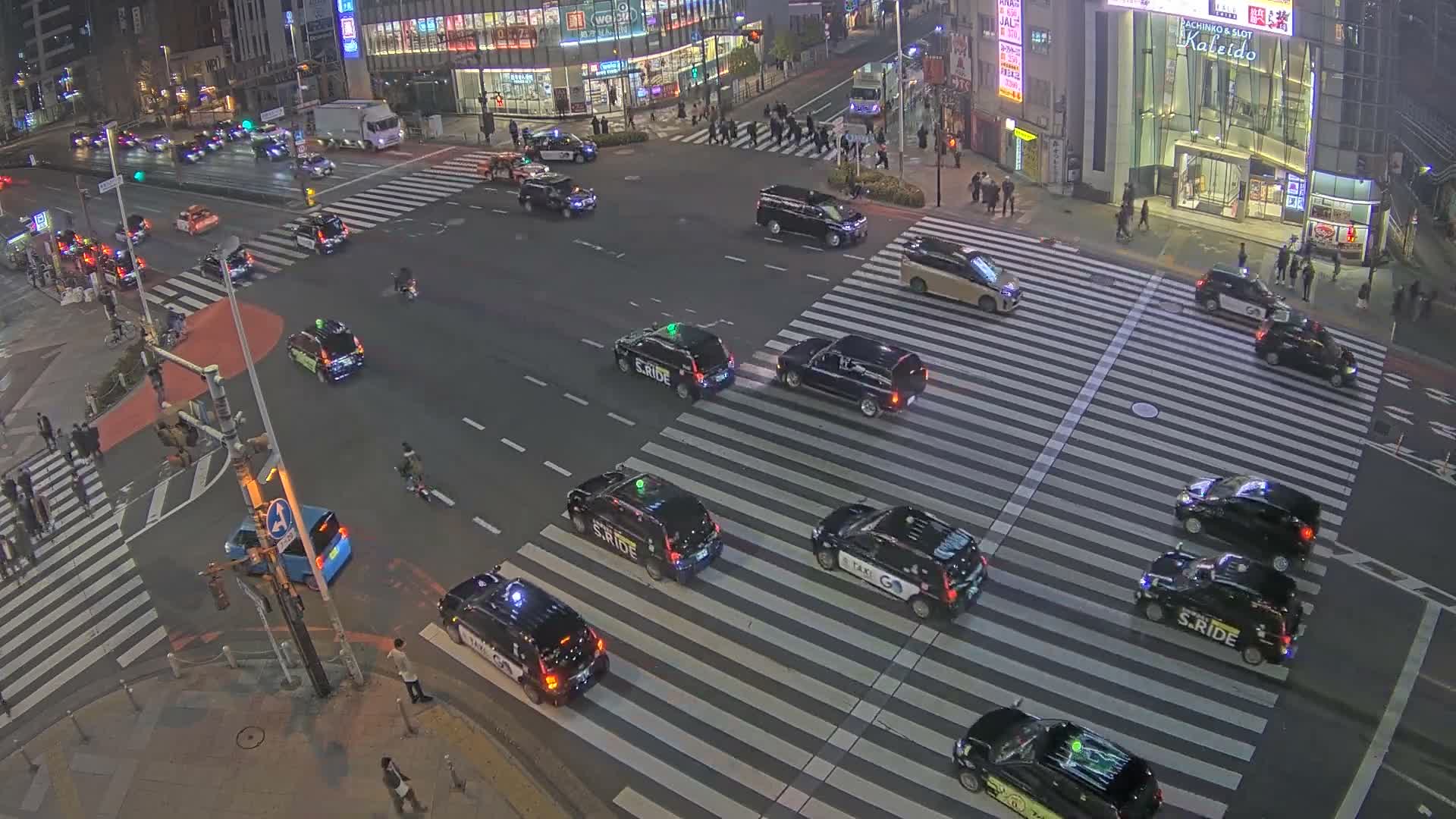 Tokyo, Shinjuku, Ome-kaido Avenue & Otakibashi-dori O Guard Intersection Scramble Crossing ( 東京 新宿青梅街道・小滝橋通り大ガード交差点スクランブル交差点) Live Cam  - Nishishinjuku, Shinjuku-ku, Tokyo, Kantō, Honshu, Japan