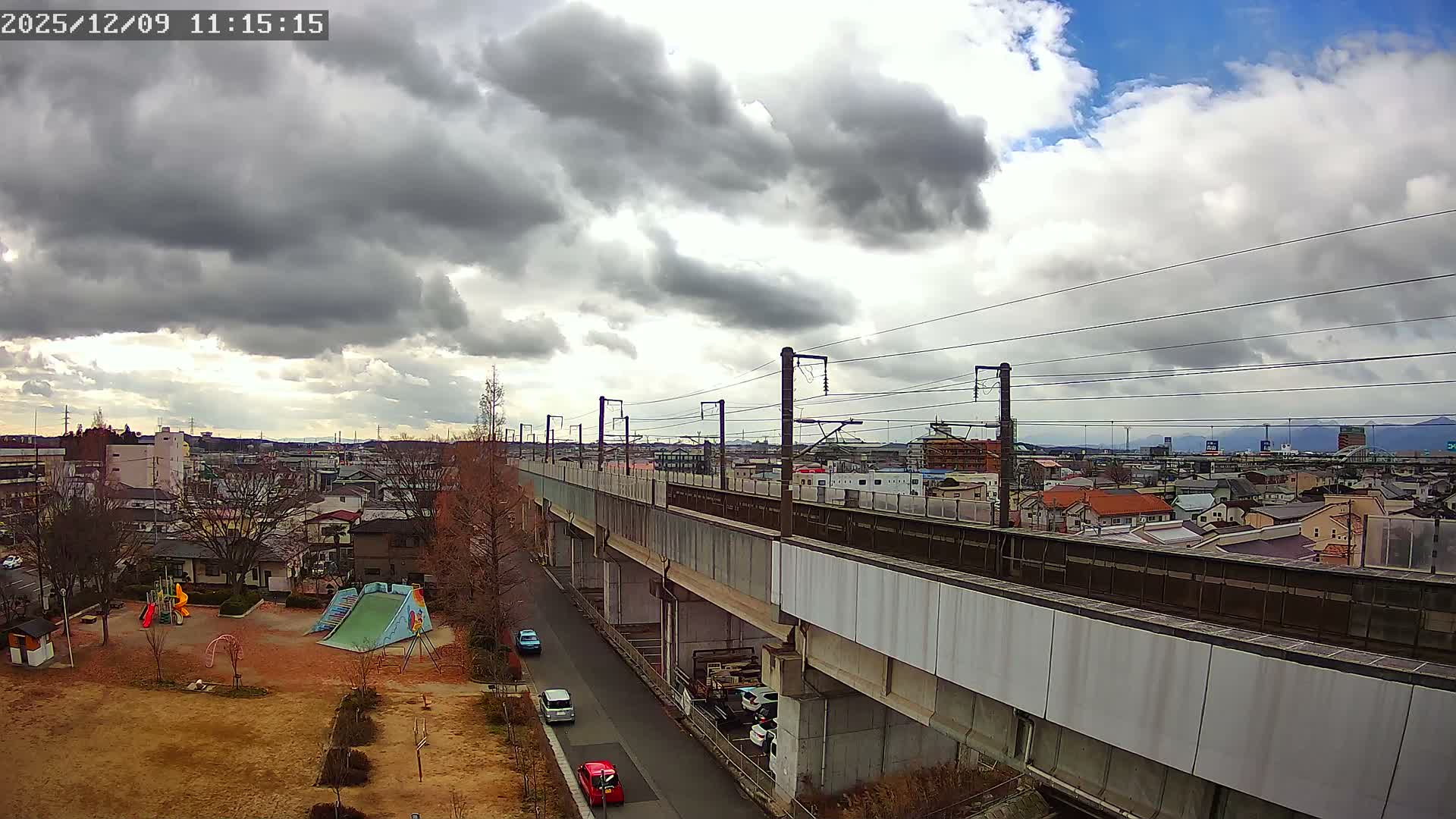 Koriyama City Skyline & Tonoku / Akita Shinkansen ( Bullet Train ) Viaduct ( 郡山市街のスカイラインと東濃・秋田新幹線高架橋 ) Live Cam - 2 Chome, Asakamachi Hidenoyama, Koriyama, Fukuşima, Tōhoku, Honshu, Japan