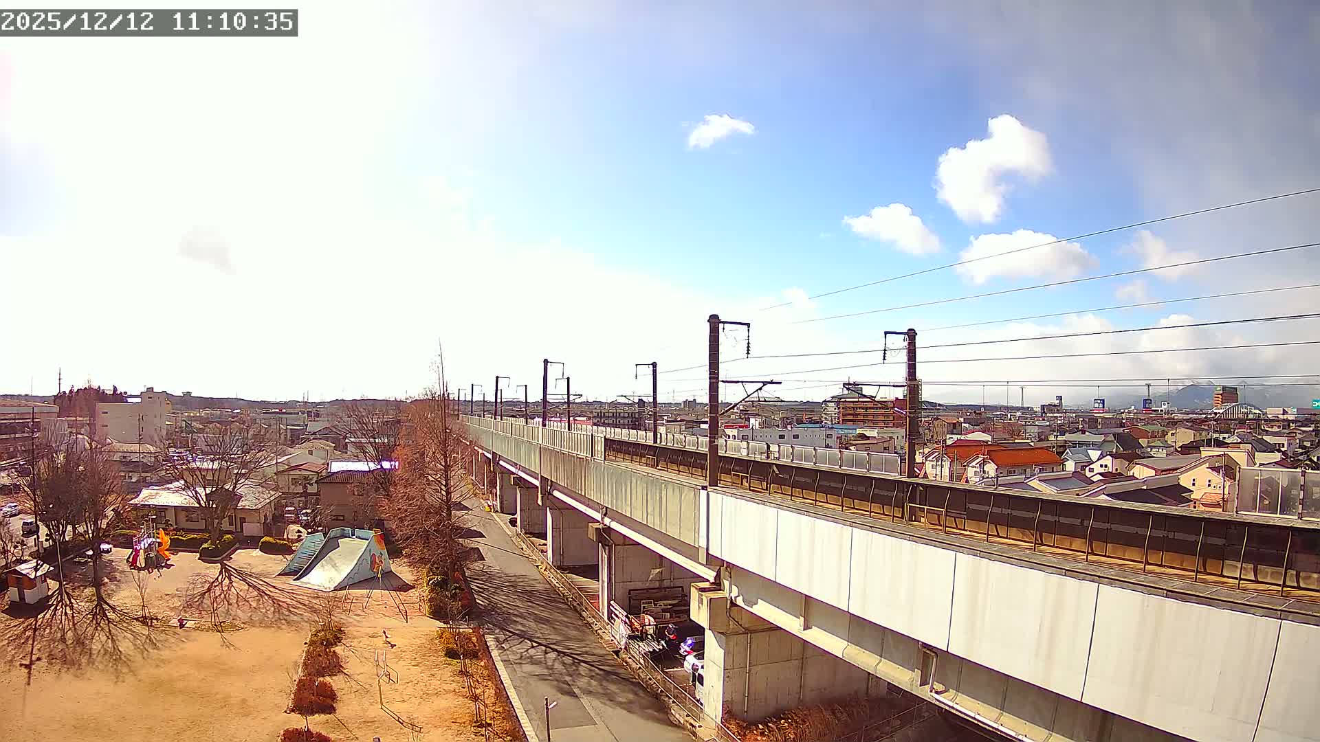 Koriyama City Skyline & Tonoku / Akita Shinkansen ( Bullet Train ) Viaduct ( 郡山市街のスカイラインと東濃・秋田新幹線高架橋 ) Live Cam - 2 Chome, Asakamachi Hidenoyama, Koriyama, Fukuşima, Tōhoku, Honshu, Japan