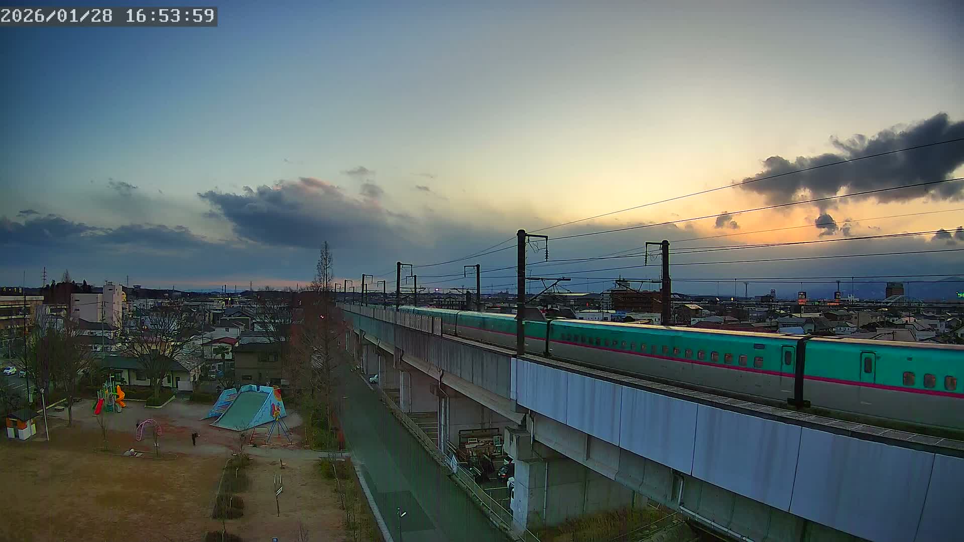 Koriyama City Skyline & Tonoku / Akita Shinkansen ( Bullet Train ) Viaduct ( 郡山市街のスカイラインと東濃・秋田新幹線高架橋 ) Live Cam - 2 Chome, Asakamachi Hidenoyama, Koriyama, Fukuşima, Tōhoku, Honshu, Japan