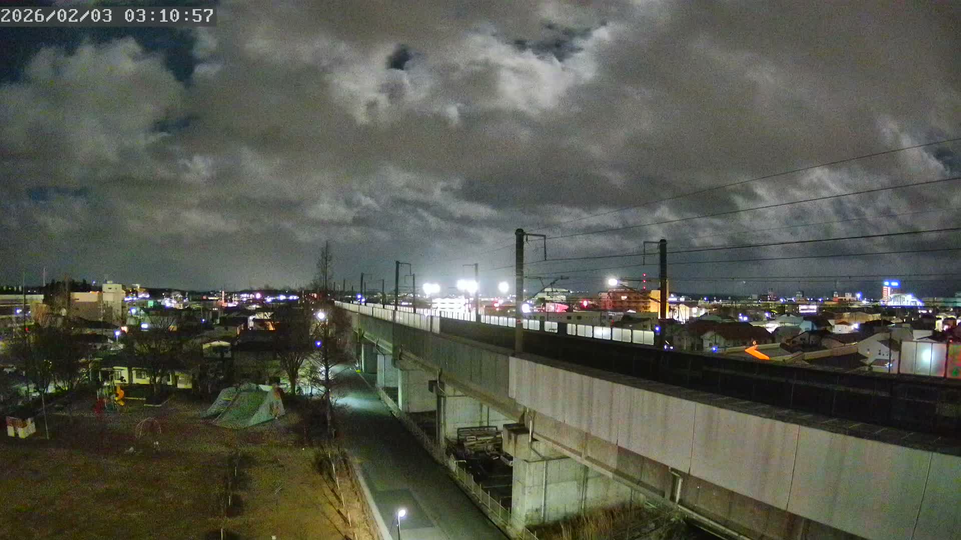 Koriyama City Skyline & Tonoku / Akita Shinkansen ( Bullet Train ) Viaduct ( 郡山市街のスカイラインと東濃・秋田新幹線高架橋 ) Live Cam - 2 Chome, Asakamachi Hidenoyama, Koriyama, Fukuşima, Tōhoku, Honshu, Japan