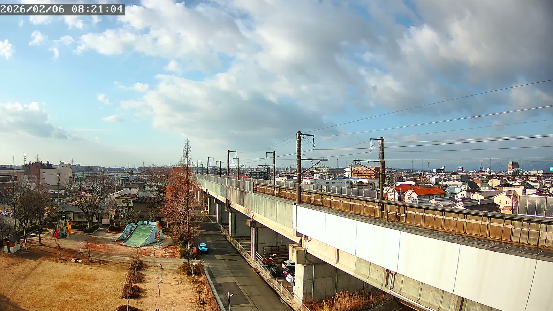 Koriyama City Skyline & Tonoku / Akita Shinkansen ( Bullet Train ) Viaduct ( 郡山市街のスカイラインと東濃・秋田新幹線高架橋 ) Live Cam - 2 Chome, Asakamachi Hidenoyama, Koriyama, Fukuşima, Tōhoku, Honshu, Japan