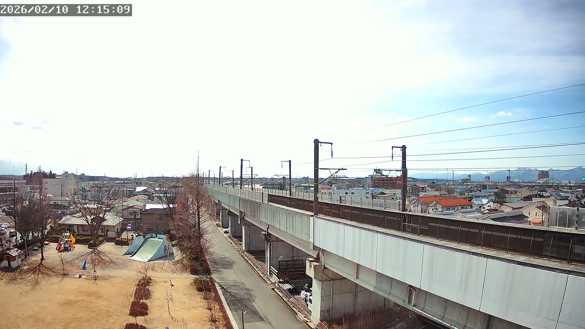 Koriyama City Skyline & Tonoku / Akita Shinkansen ( Bullet Train ) Viaduct ( 郡山市街のスカイラインと東濃・秋田新幹線高架橋 ) Live Cam - 2 Chome, Asakamachi Hidenoyama, Koriyama, Fukuşima, Tōhoku, Honshu, Japan