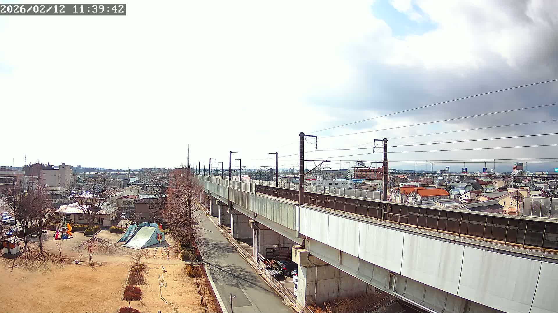 Koriyama City Skyline & Tonoku / Akita Shinkansen ( Bullet Train ) Viaduct ( 郡山市街のスカイラインと東濃・秋田新幹線高架橋 ) Live Cam - 2 Chome, Asakamachi Hidenoyama, Koriyama, Fukuşima, Tōhoku, Honshu, Japan