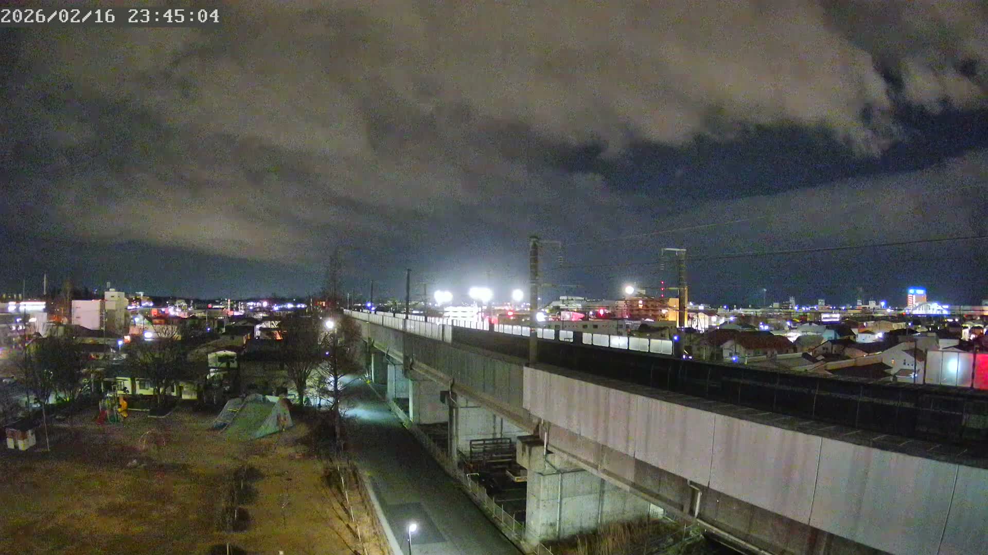 Koriyama City Skyline & Tonoku / Akita Shinkansen ( Bullet Train ) Viaduct ( 郡山市街のスカイラインと東濃・秋田新幹線高架橋 ) Live Cam - 2 Chome, Asakamachi Hidenoyama, Koriyama, Fukuşima, Tōhoku, Honshu, Japan