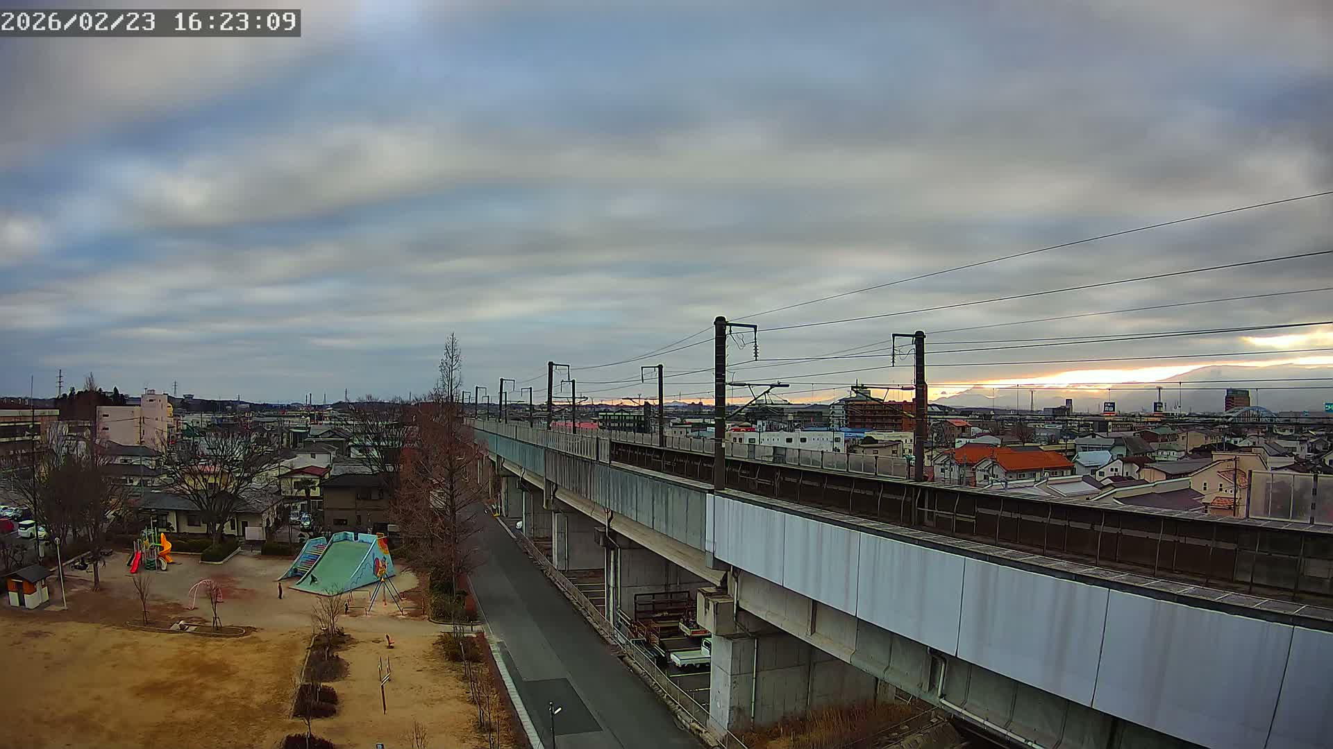 Koriyama City Skyline & Tonoku / Akita Shinkansen ( Bullet Train ) Viaduct ( 郡山市街のスカイラインと東濃・秋田新幹線高架橋 ) Live Cam - 2 Chome, Asakamachi Hidenoyama, Koriyama, Fukuşima, Tōhoku, Honshu, Japan