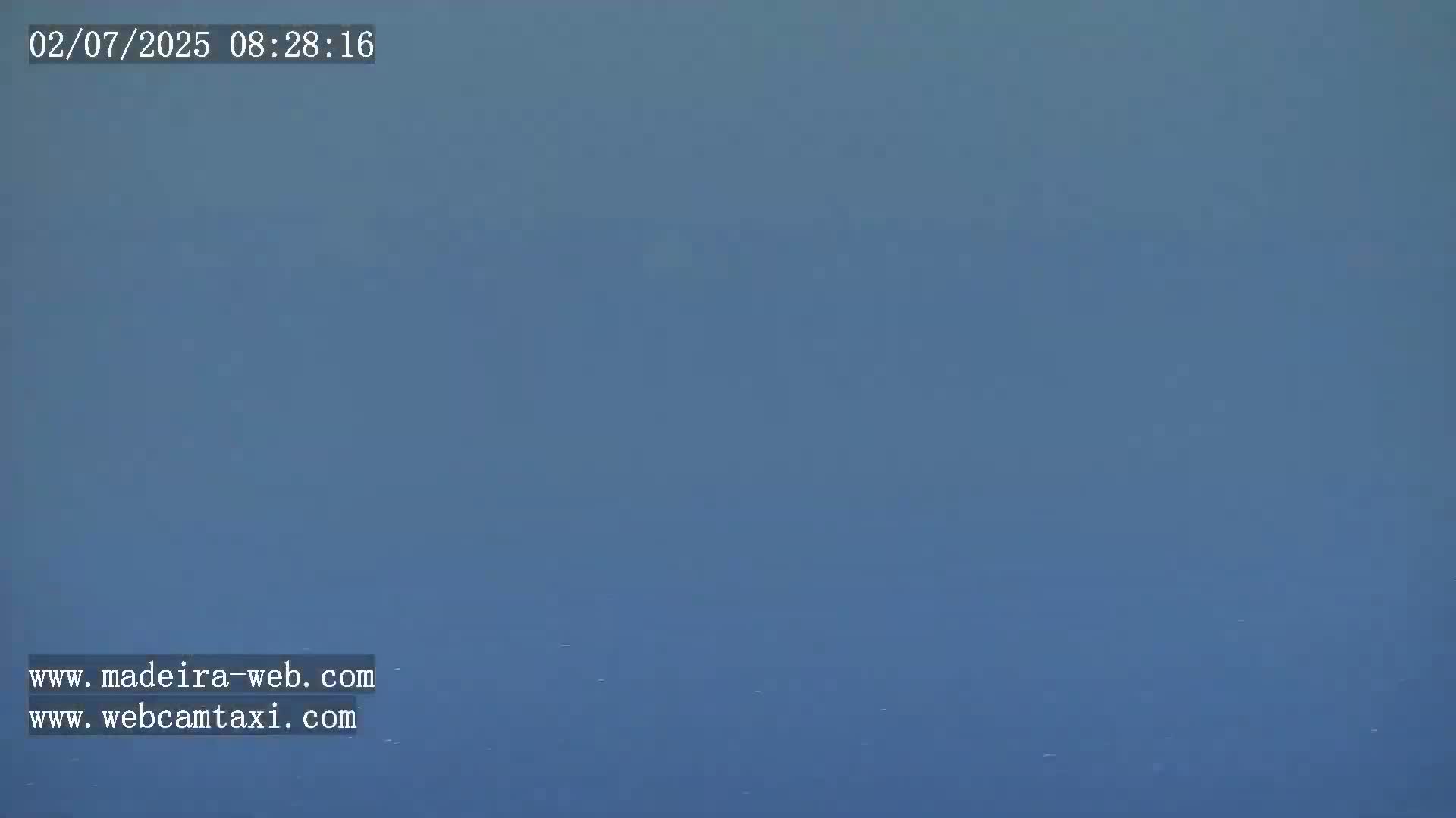 A hazy, blue sky is visible.