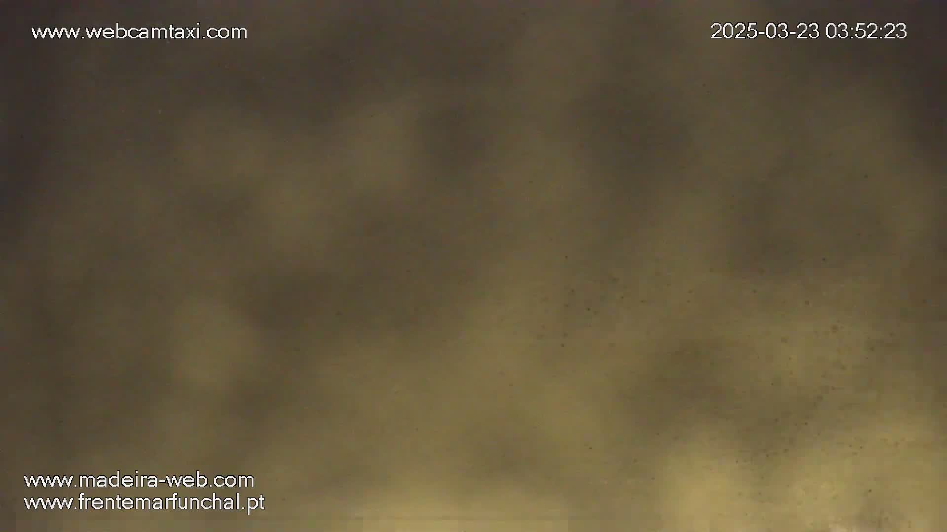 A blurry, muted brown image shows a hazy or foggy atmosphere.