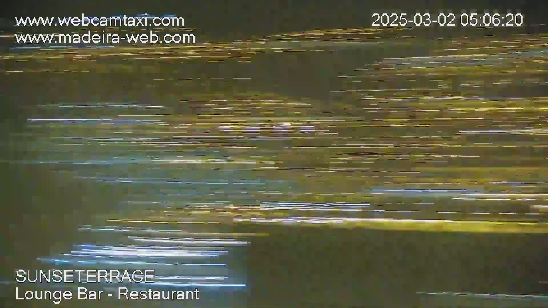 A blurry image shows streaks of light, likely from light trails at night.