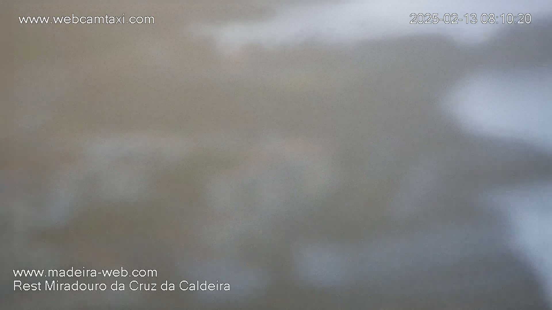 A blurry, hazy view of an outdoor scene in foggy or misty conditions.