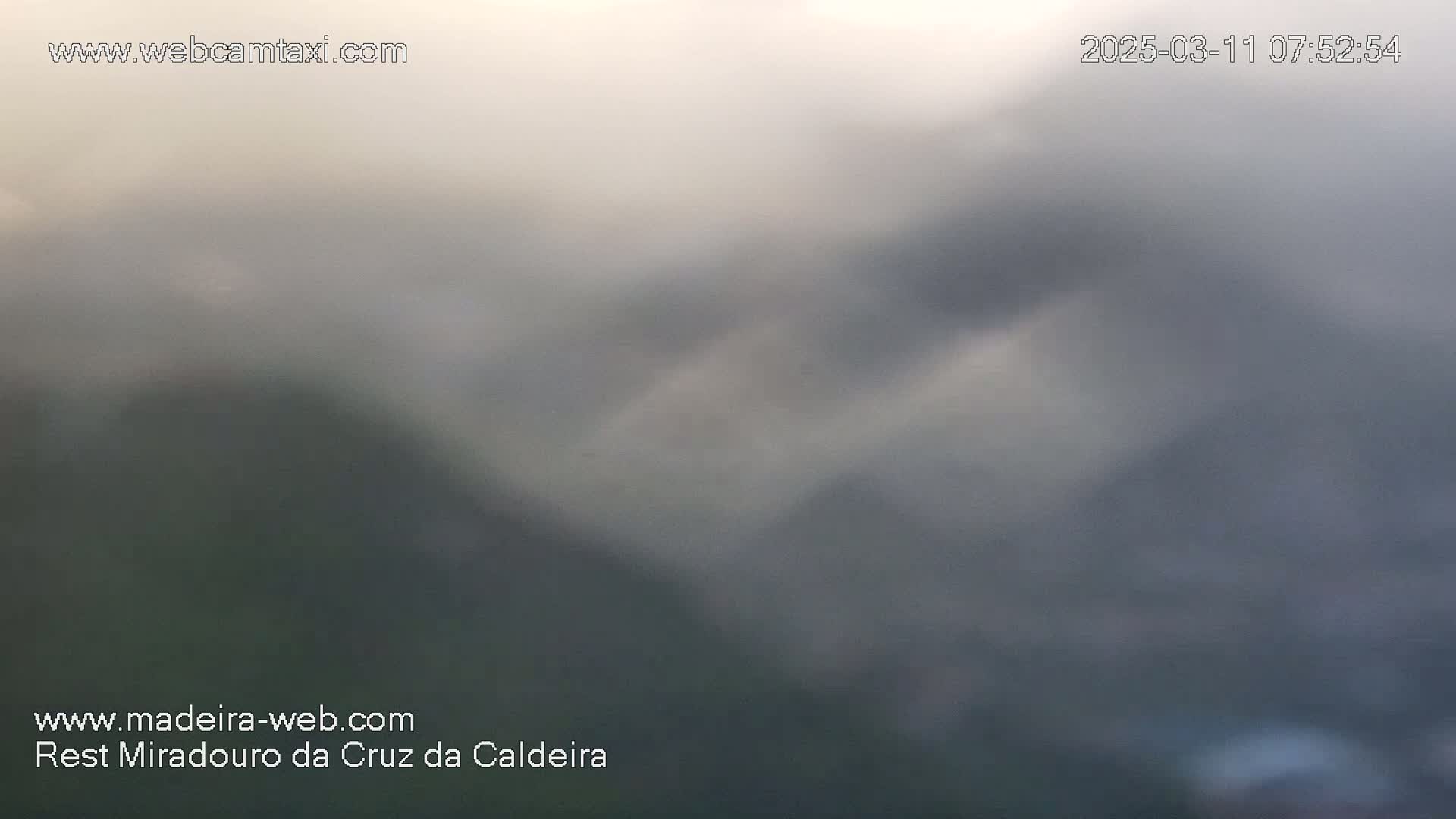 A hazy, overcast view of a mountainous landscape.