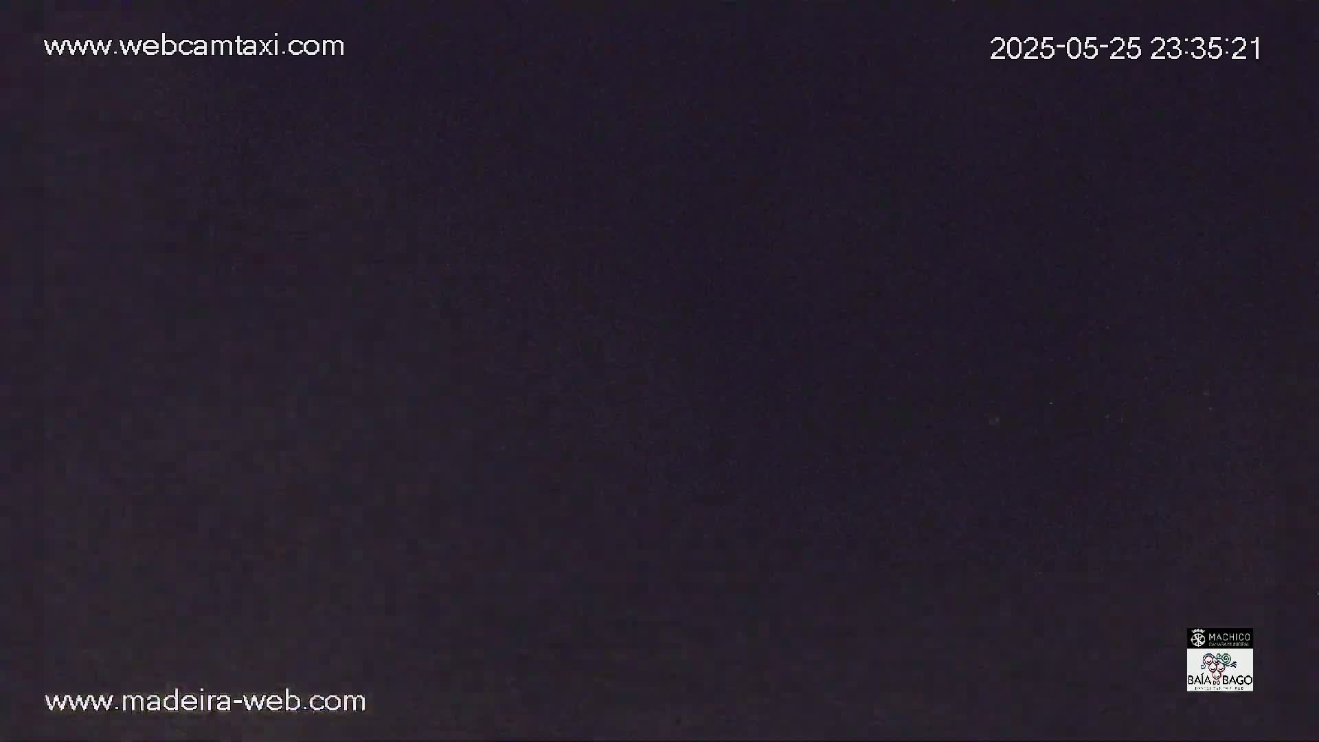 A dark, nighttime image shows a completely black screen.