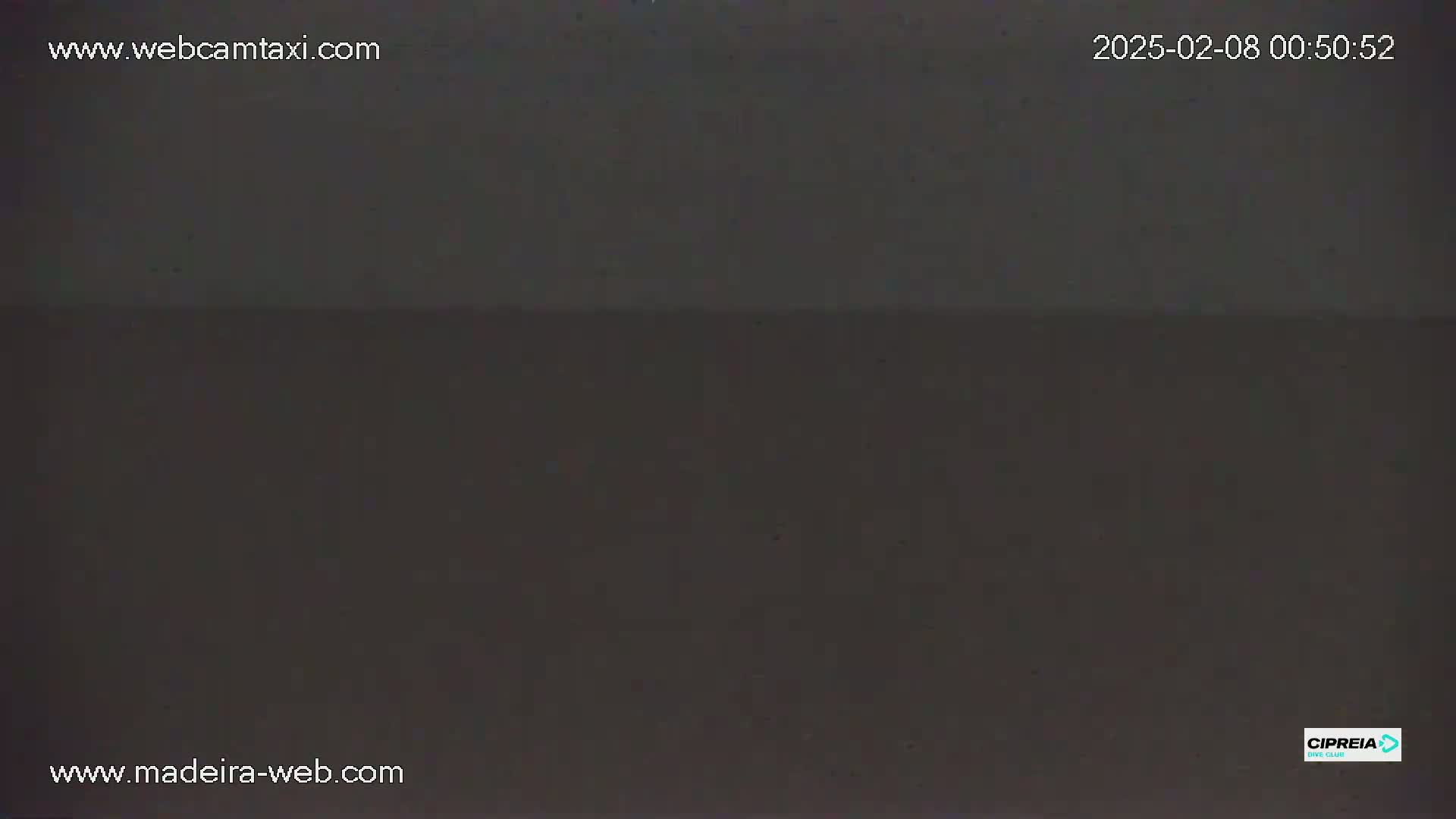 A dark, possibly nighttime, image shows a solid, uniformly dark gray or black expanse.