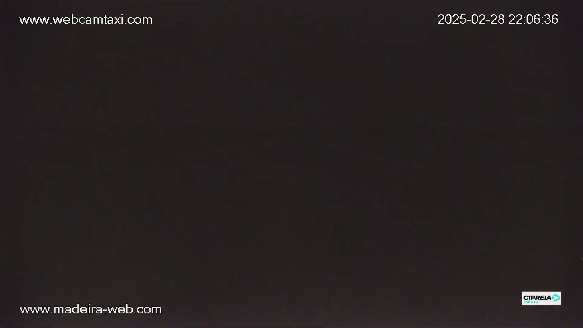 The image shows a completely dark scene at night.