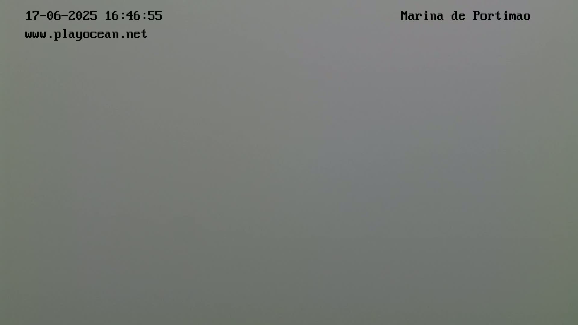 The image shows a solid, light gray screen.