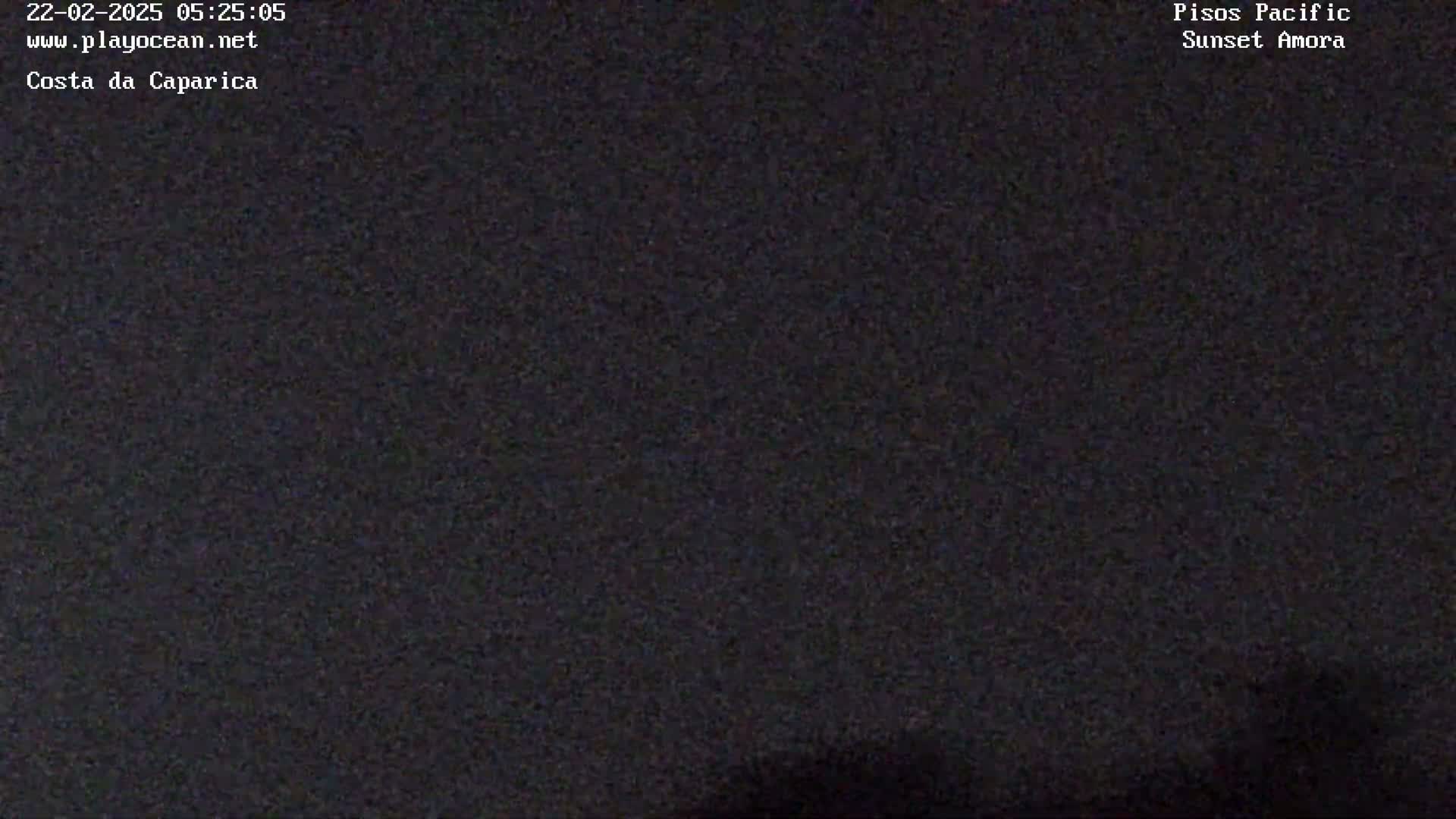 A grainy, dark image shows a mostly black field of view.
